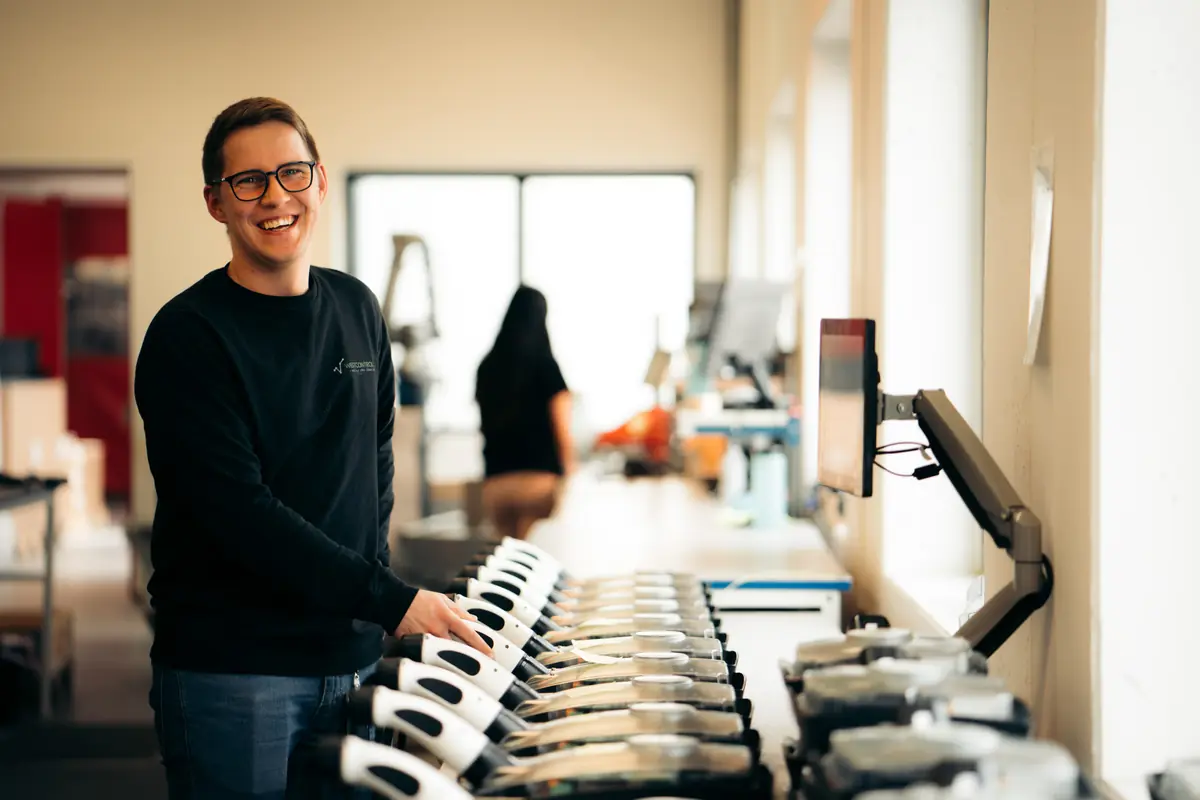 Employee assembling products at a workstation