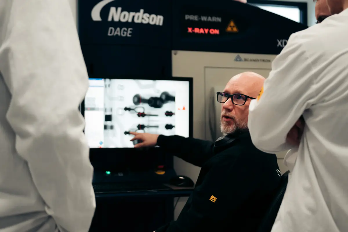 Engineer at an X-ray inspection machine for circuit boards